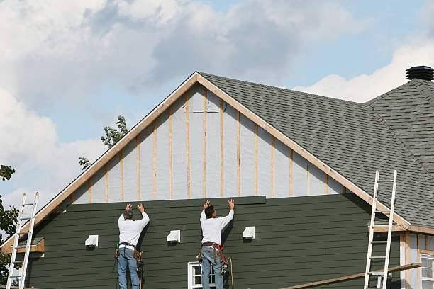 Professional Storm Damage Siding Repair technician working in Irwin, PA